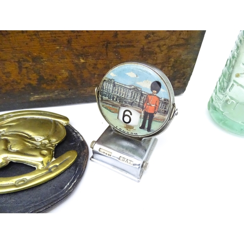 311 - A quantity of miscellaneous items contained within a wooden box to include a paperweight, a codd bot... 