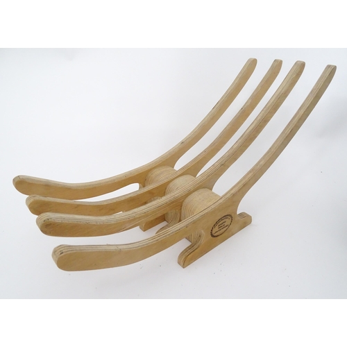 312 - A quantity of assorted kitchenalia to include a wooden chopping board, egg basket / holder, etc.