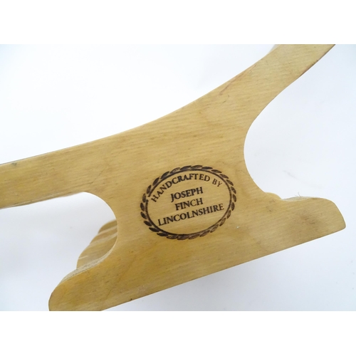 312 - A quantity of assorted kitchenalia to include a wooden chopping board, egg basket / holder, etc.