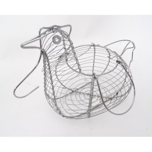 312 - A quantity of assorted kitchenalia to include a wooden chopping board, egg basket / holder, etc.