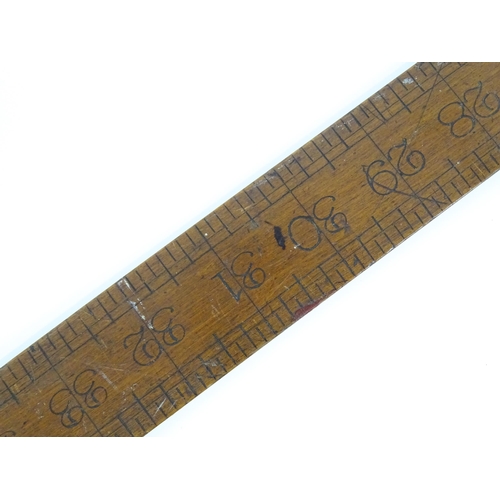 321 - An early 20thC architect's expanding rule stamped 'Smith Day & Co 1919', together with a mahogany ru... 