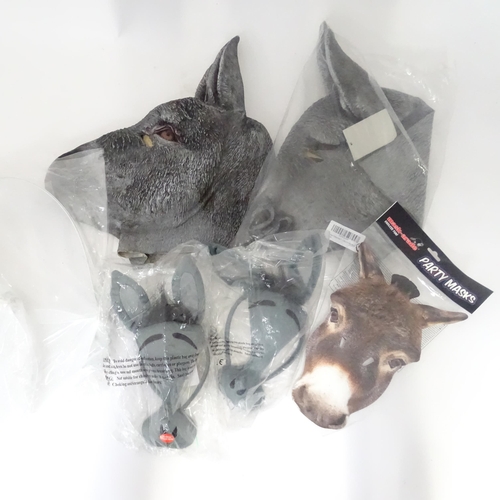 340 - A quantity of fancy dress items to include donkey masks, angel wings, etc.