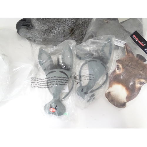 340 - A quantity of fancy dress items to include donkey masks, angel wings, etc.