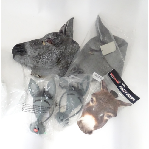 340 - A quantity of fancy dress items to include donkey masks, angel wings, etc.