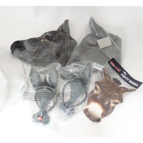 340 - A quantity of fancy dress items to include donkey masks, angel wings, etc.