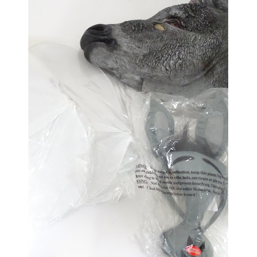 340 - A quantity of fancy dress items to include donkey masks, angel wings, etc.