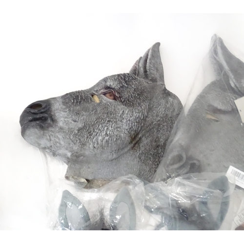 340 - A quantity of fancy dress items to include donkey masks, angel wings, etc.