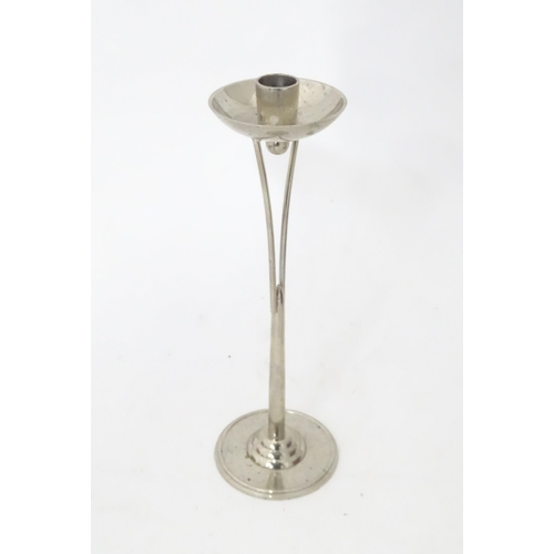 344 - A quantity of assorted metalwares to include a candlestick, copper chamberstick, inkwells, Art Nouve... 