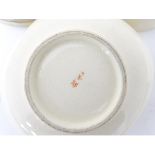 353 - A quantity of Oriental items to include Japanese tea wares with quail detail, a small cast deity, tw... 