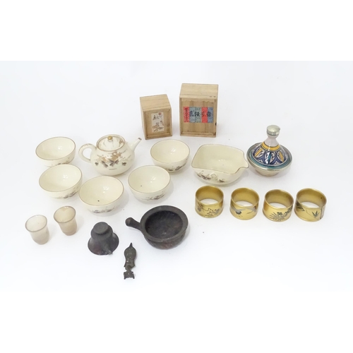 353 - A quantity of Oriental items to include Japanese tea wares with quail detail, a small cast deity, tw... 