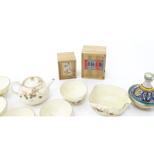 353 - A quantity of Oriental items to include Japanese tea wares with quail detail, a small cast deity, tw... 