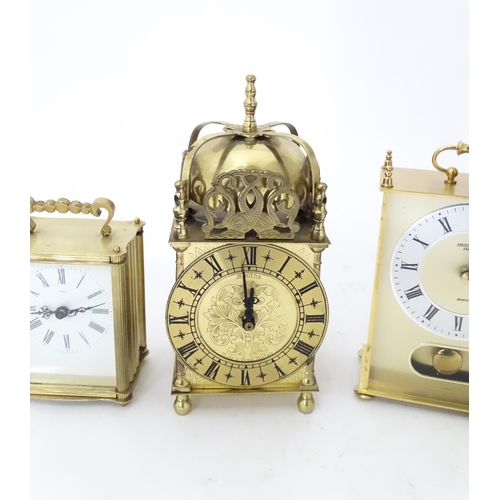 365 - A quantity of assorted quartz clocks to include carriage clock examples and a Lantern clock by Smith... 