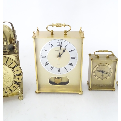 365 - A quantity of assorted quartz clocks to include carriage clock examples and a Lantern clock by Smith... 