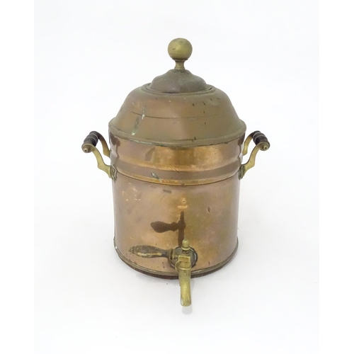 376 - A late 19th / early 20thC copper samovar of cylindrical form with twin handles. Approx. 14 3/4
