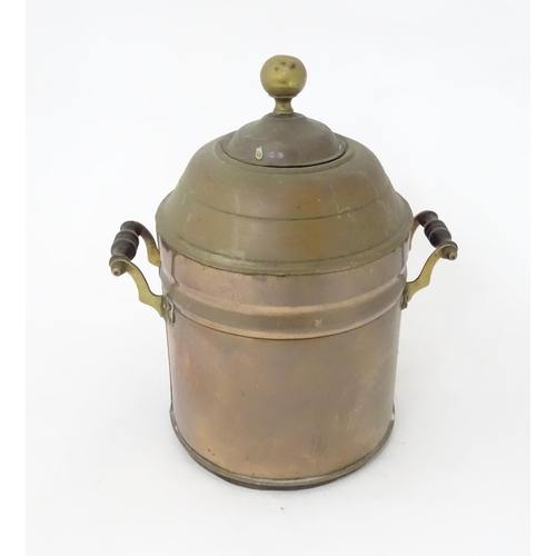 376 - A late 19th / early 20thC copper samovar of cylindrical form with twin handles. Approx. 14 3/4