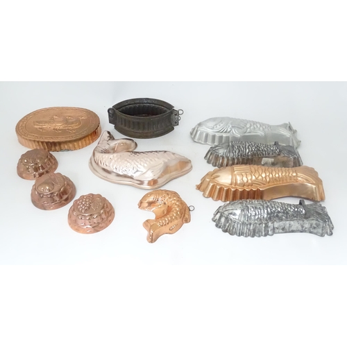 397 - A quantity of assorted jelly, mousse, pie and flan moulds, many of fish form. Largest approx. 12 1/4... 