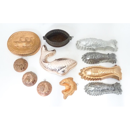 397 - A quantity of assorted jelly, mousse, pie and flan moulds, many of fish form. Largest approx. 12 1/4... 