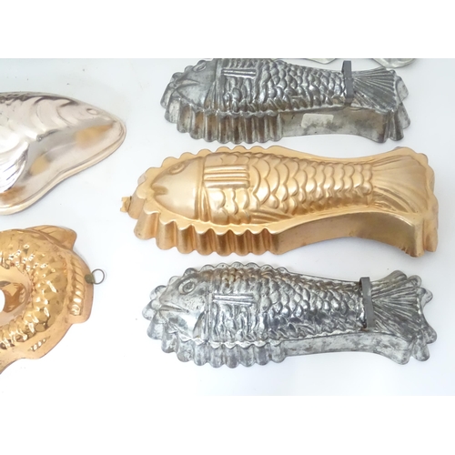 397 - A quantity of assorted jelly, mousse, pie and flan moulds, many of fish form. Largest approx. 12 1/4... 