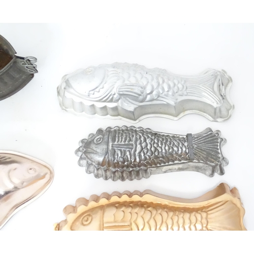 397 - A quantity of assorted jelly, mousse, pie and flan moulds, many of fish form. Largest approx. 12 1/4... 