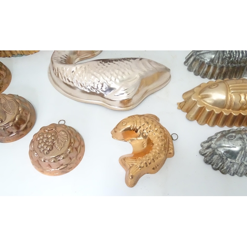 397 - A quantity of assorted jelly, mousse, pie and flan moulds, many of fish form. Largest approx. 12 1/4... 