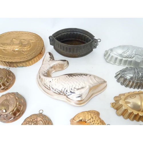 397 - A quantity of assorted jelly, mousse, pie and flan moulds, many of fish form. Largest approx. 12 1/4... 