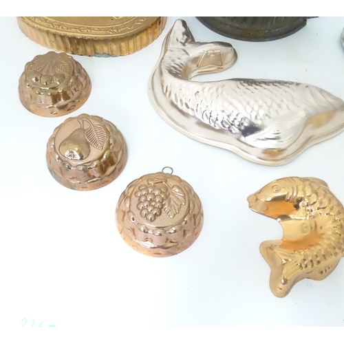 397 - A quantity of assorted jelly, mousse, pie and flan moulds, many of fish form. Largest approx. 12 1/4... 
