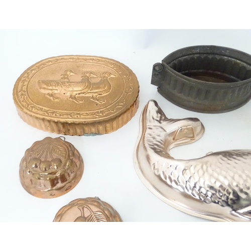 397 - A quantity of assorted jelly, mousse, pie and flan moulds, many of fish form. Largest approx. 12 1/4... 