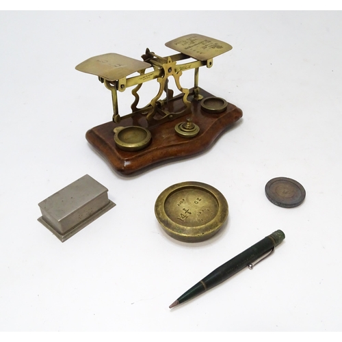 708 - Postal scales by T. J. Smith, Son & Co. of London. Together with associated weights, a stamp box, an... 
