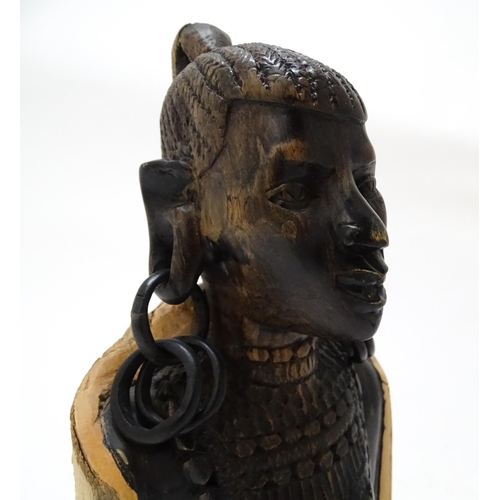710 - Ethnographic / Native / Tribal : An African hardwood carving modelled as a woman with large hoop ear... 