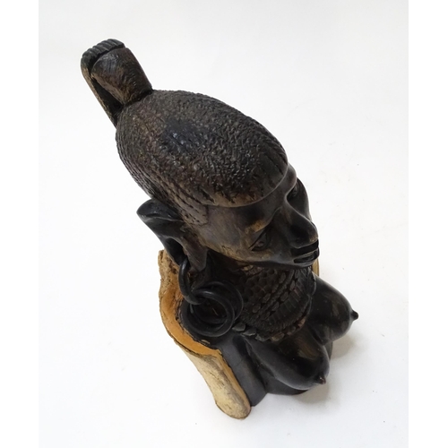 710 - Ethnographic / Native / Tribal : An African hardwood carving modelled as a woman with large hoop ear... 