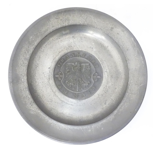 717 - A German pewter dish with central eagle motif Frankfurt Am Main. Marked to reverse Roders Soltauer Z... 