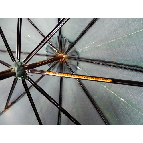 719 - An 'Eldonian' shooting stick, together with a mid 20thC umbrella with a carved wooden handle, and a ... 