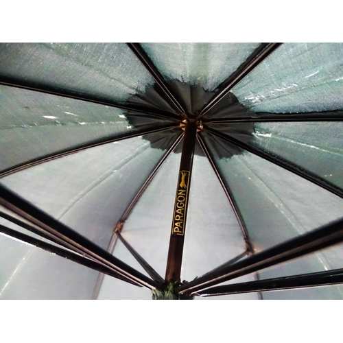 719 - An 'Eldonian' shooting stick, together with a mid 20thC umbrella with a carved wooden handle, and a ... 