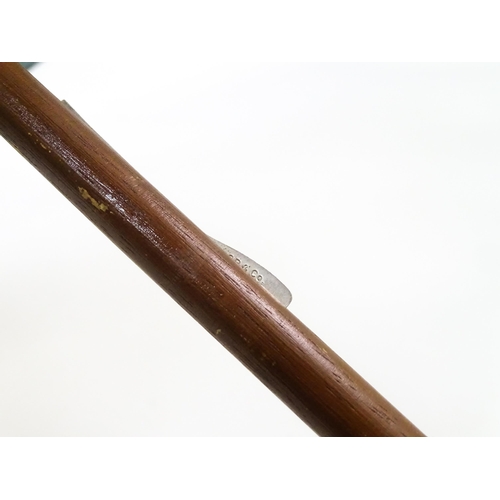 719 - An 'Eldonian' shooting stick, together with a mid 20thC umbrella with a carved wooden handle, and a ... 