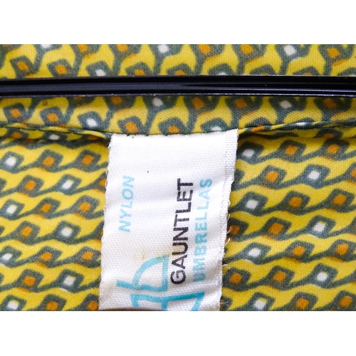 719 - An 'Eldonian' shooting stick, together with a mid 20thC umbrella with a carved wooden handle, and a ... 