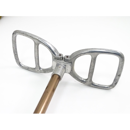 719 - An 'Eldonian' shooting stick, together with a mid 20thC umbrella with a carved wooden handle, and a ... 