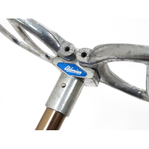 719 - An 'Eldonian' shooting stick, together with a mid 20thC umbrella with a carved wooden handle, and a ... 