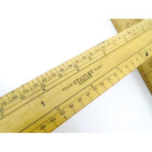 727 - A quantity of rules and rulers to include folding boxwood examples. Together with various magnifying... 