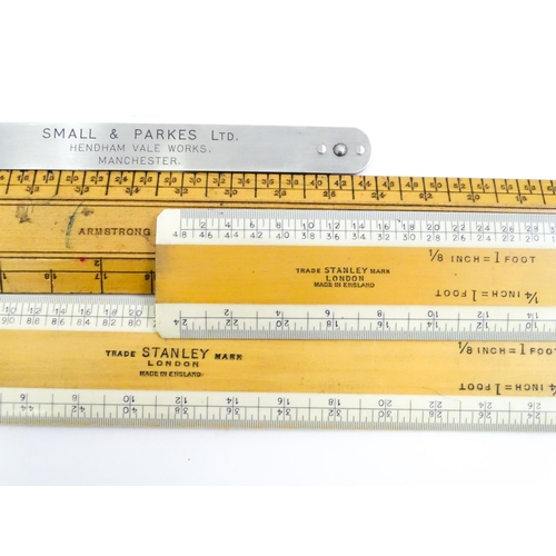 727 - A quantity of rules and rulers to include folding boxwood examples. Together with various magnifying... 