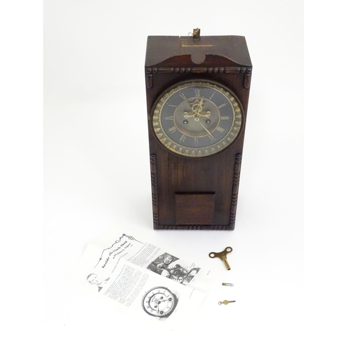 729 - An Edwardian wall clock, the stained oak case housing a black and gilt numeral dial with Brocot visi... 