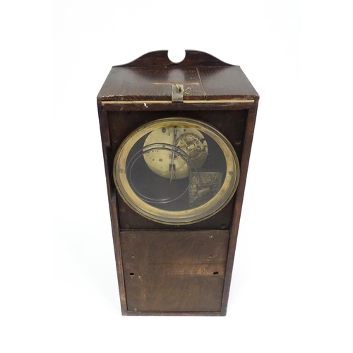 729 - An Edwardian wall clock, the stained oak case housing a black and gilt numeral dial with Brocot visi... 