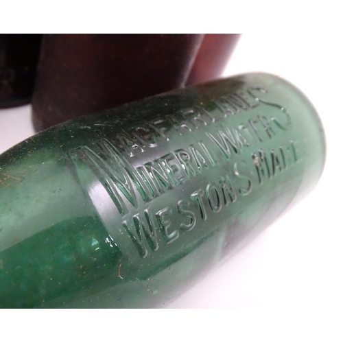 76 - A quantity of early to mid 20thC glass bottles, to include codd lemonade / soda bottles, brown glass... 