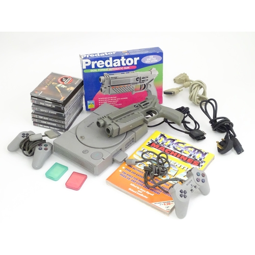 792 - Toys: A Sony PlayStation 1 (PS1 / PSX) video game console, with two controllers and a Predator dual ... 