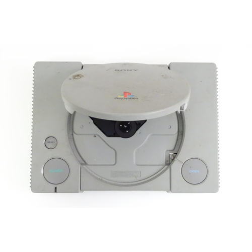 792 - Toys: A Sony PlayStation 1 (PS1 / PSX) video game console, with two controllers and a Predator dual ... 