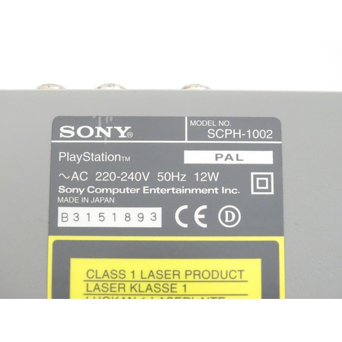 792 - Toys: A Sony PlayStation 1 (PS1 / PSX) video game console, with two controllers and a Predator dual ... 