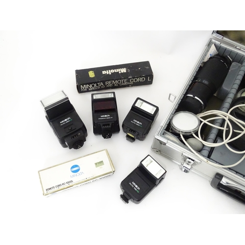 806 - A Minolta X-700 35mm SLR Film Camera together with a quantity of lenses and equipment to include a M... 