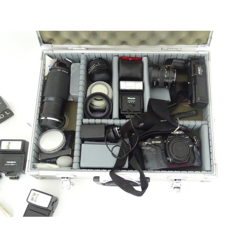 806 - A Minolta X-700 35mm SLR Film Camera together with a quantity of lenses and equipment to include a M... 