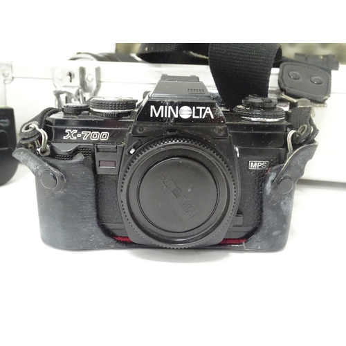 806 - A Minolta X-700 35mm SLR Film Camera together with a quantity of lenses and equipment to include a M... 