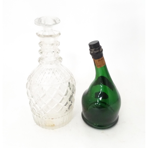 808 - A 20thC cut glass decanter and stopper. Together with a shaped green bottle labelled Saint Vivant Ar... 