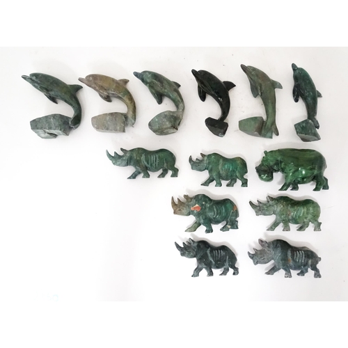 812 - A quantity of carved soapstone animals to include dolphins and rhinos. Largest approx. 4 1/4